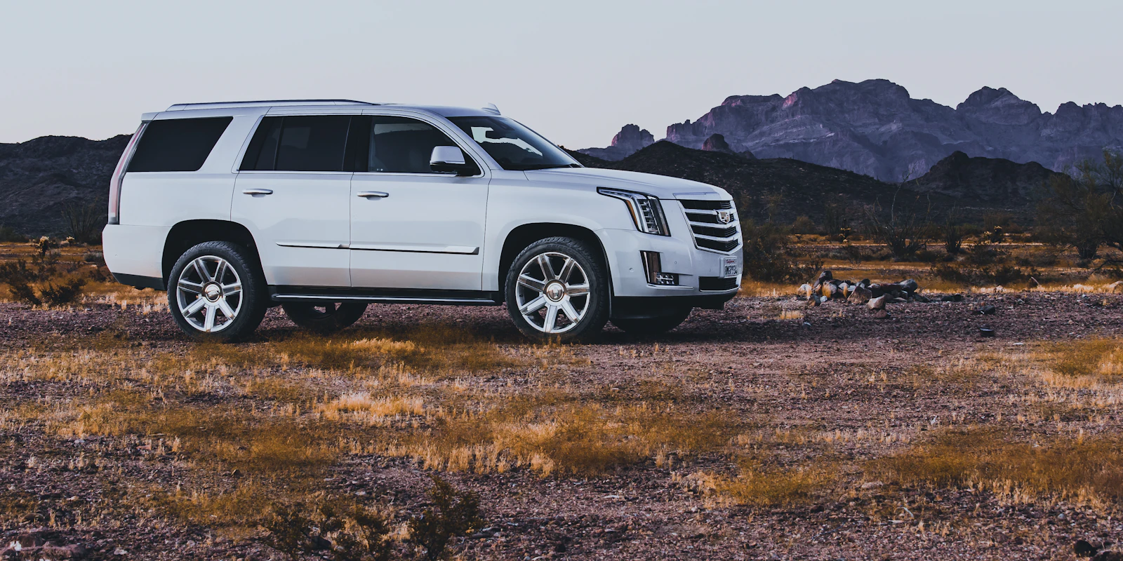 Pearl white Cadillac Escalade in the Arizona desert